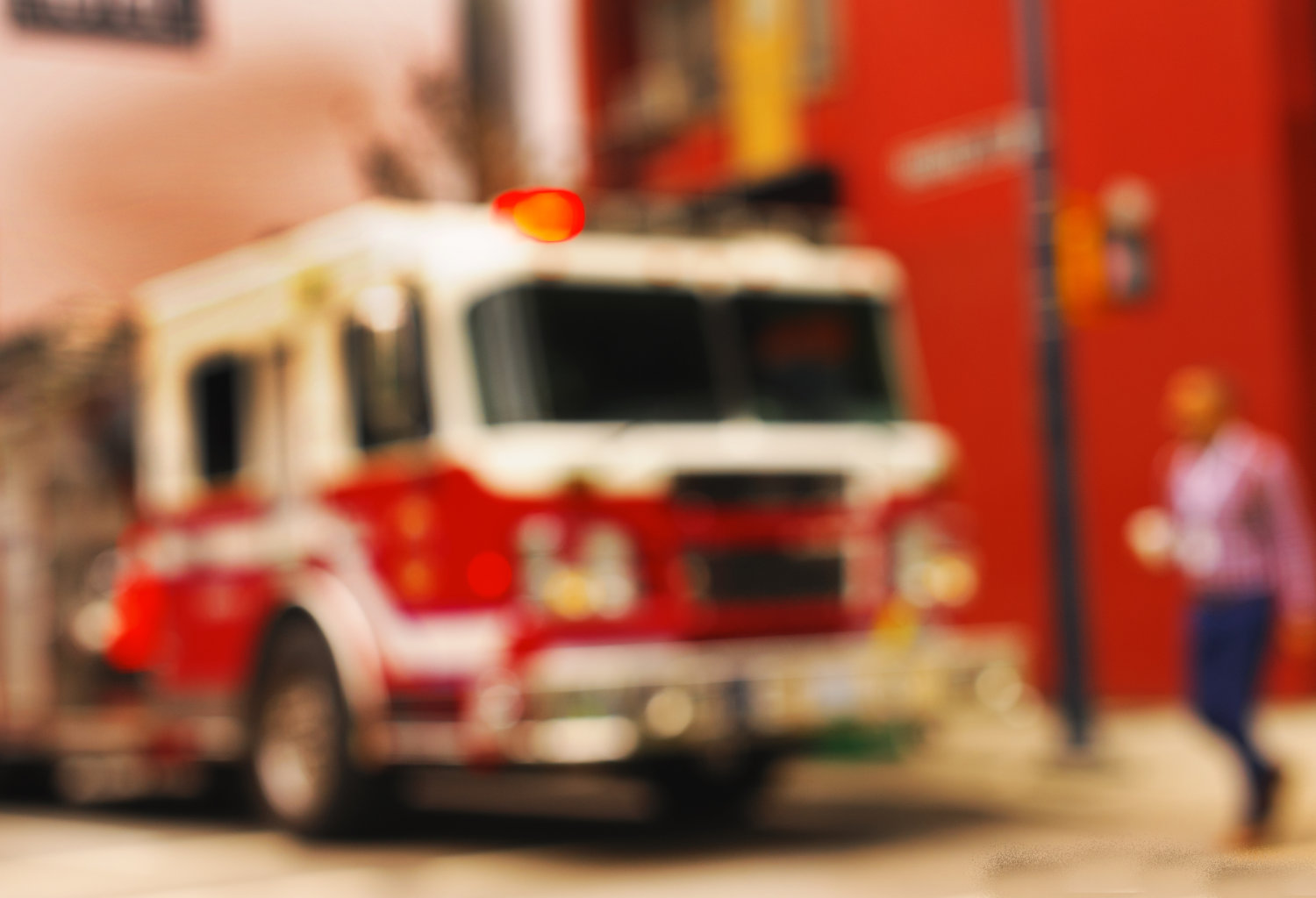 Blurred image of a fire engine on a city street